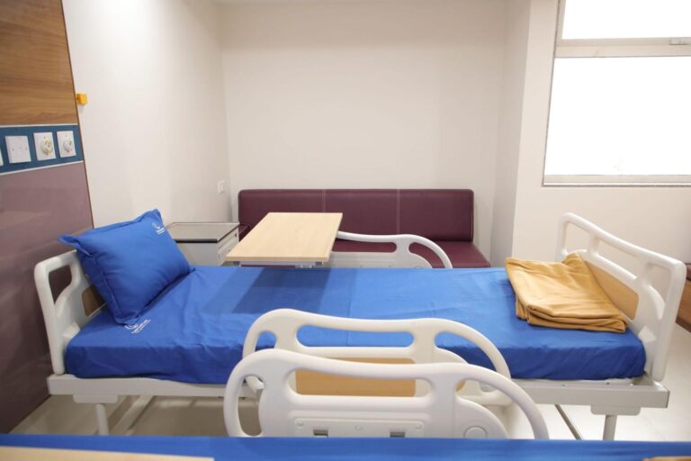 side image of bed in Care and Cure Multispeciality Hospital