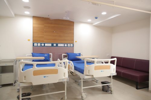 Modern hospital room at Care and Cure Multispeciality Hospital in Ahmedabad.