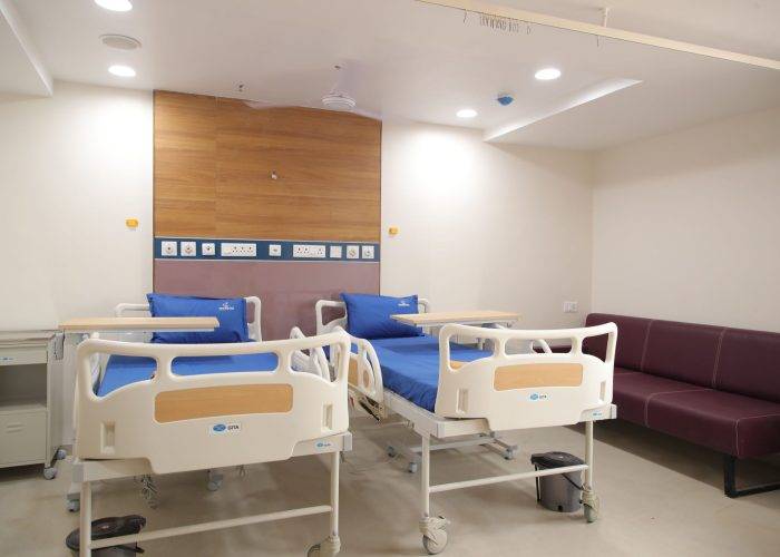 Modern hospital room at Care and Cure Multispeciality Hospital in Ahmedabad.