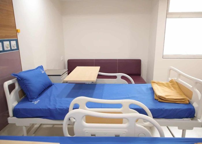 side image of bed in Care and Cure Multispeciality Hospital